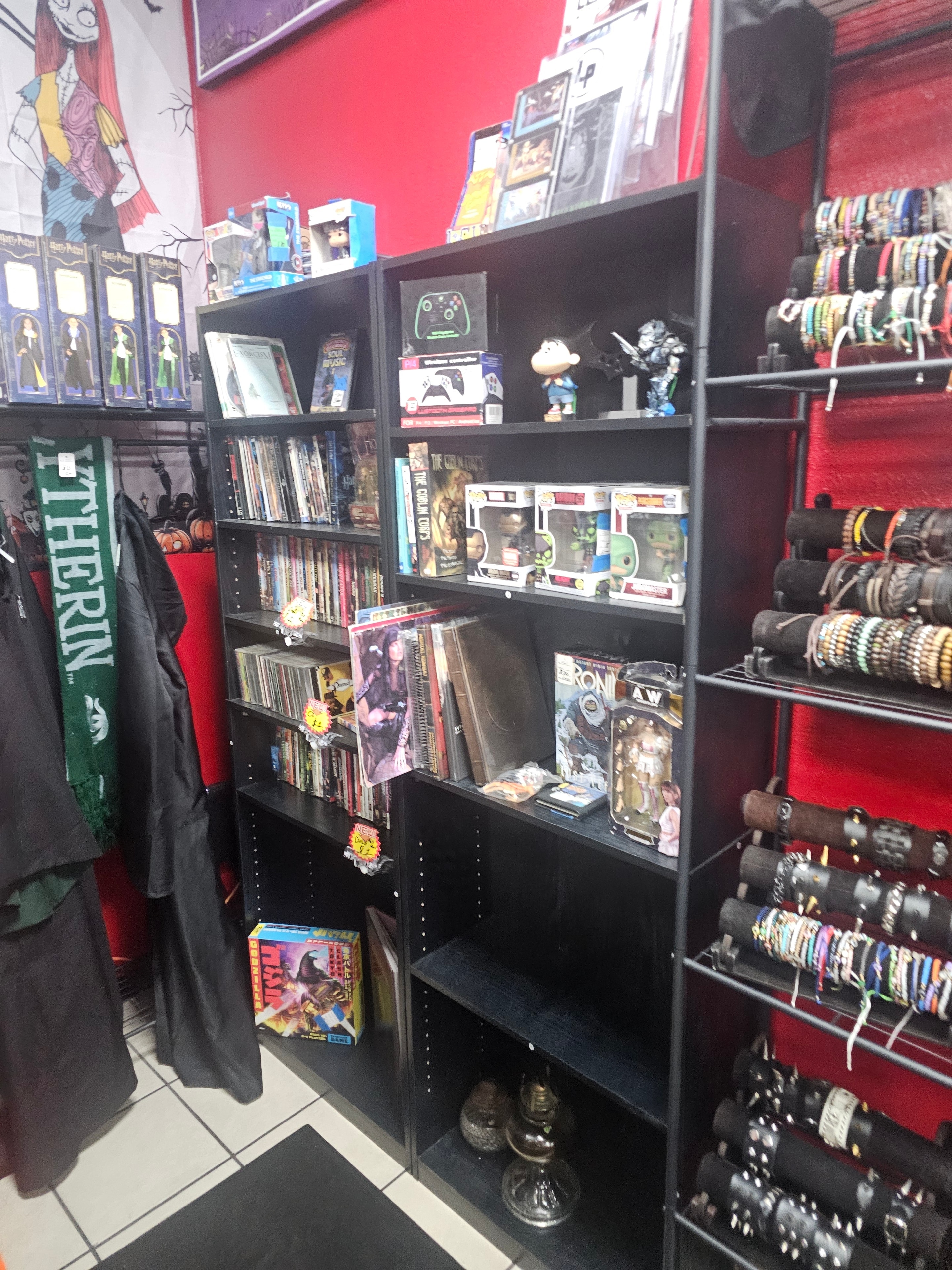 Merchant's Marketplace booth with collectibles, comics, and Funko Pops