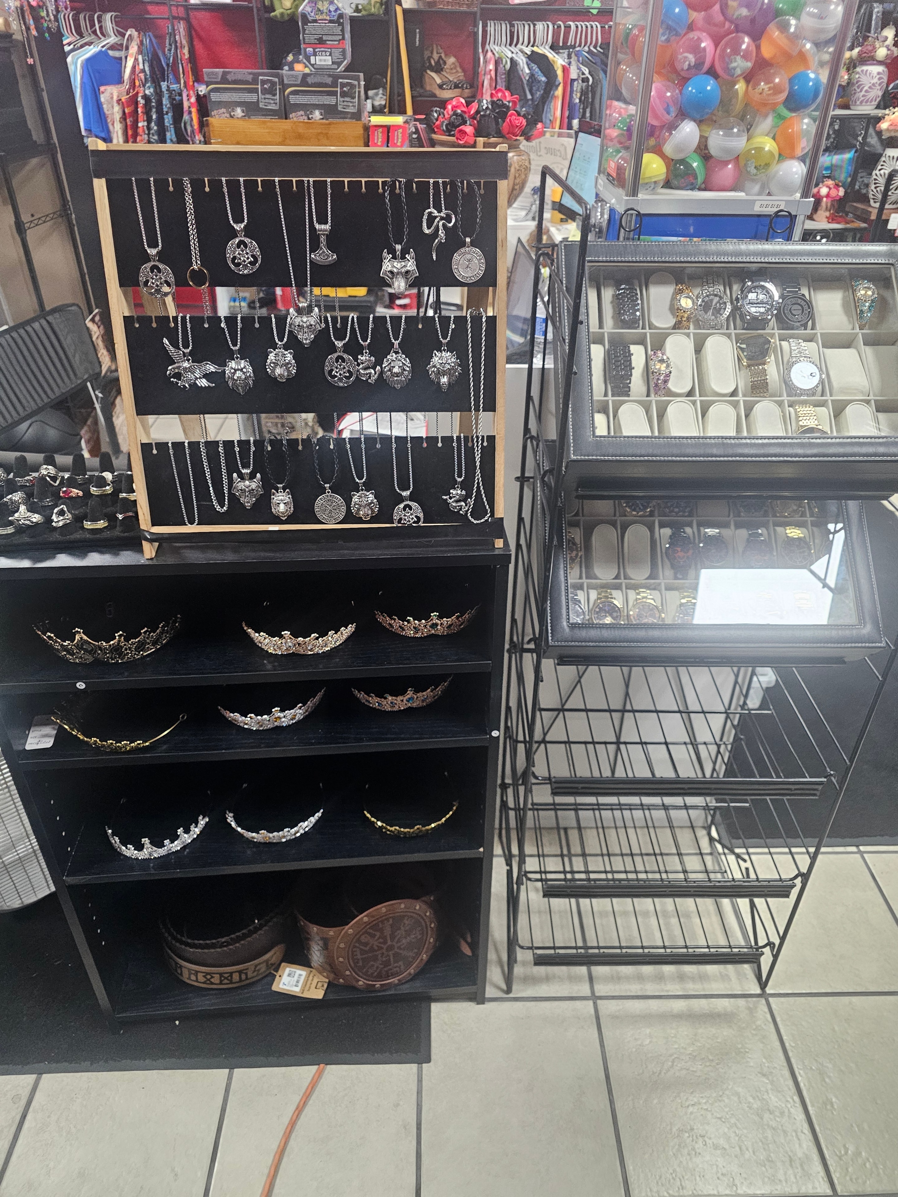Merchant's Marketplace jewelry display with necklaces, crowns, and watches