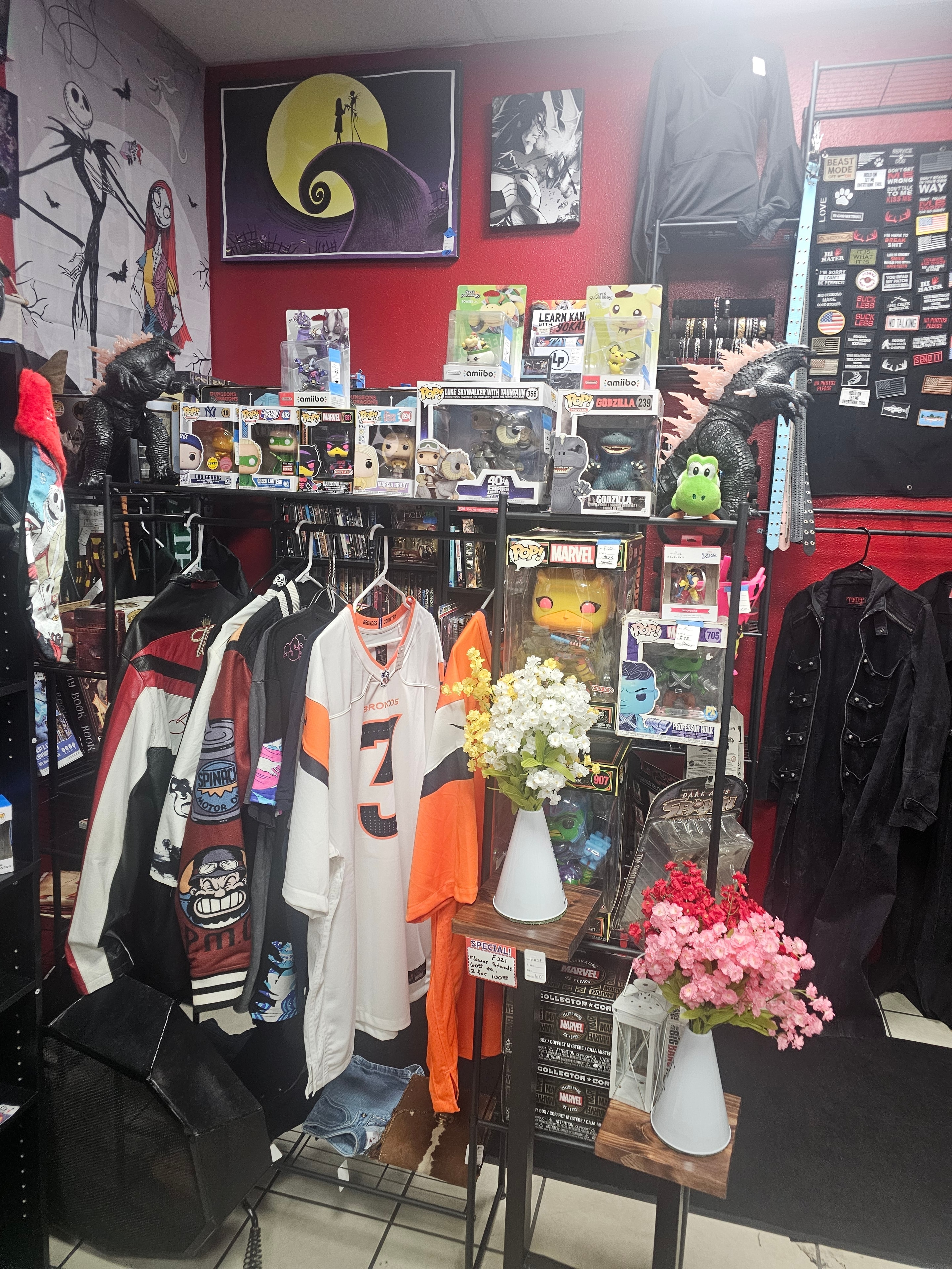 Merchant's Marketplace pop culture booth with Funko Pops, jerseys, and collectibles